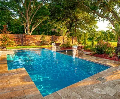 A Leisure Pools fiberglass pool in Crystal Blue color